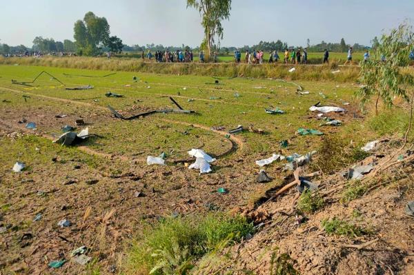 Debris is spread out on a field after the explosion at a fireworks factory near Sala Khao township in Thailand's Suphan Buri province on Jan. 17, 2024. 