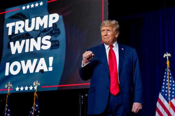 Republican presidential candidate former President Do<em></em>nald Trump takes the stage at a caucus night party in Des Moines, Iowa, Monday, Jan. 15, 2024.