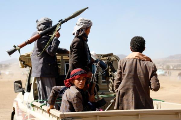 Houthi fighters and tribesmen stage a rally against the U.S. and the U.K. strikes on Houthi-run military sites near Sanaa.